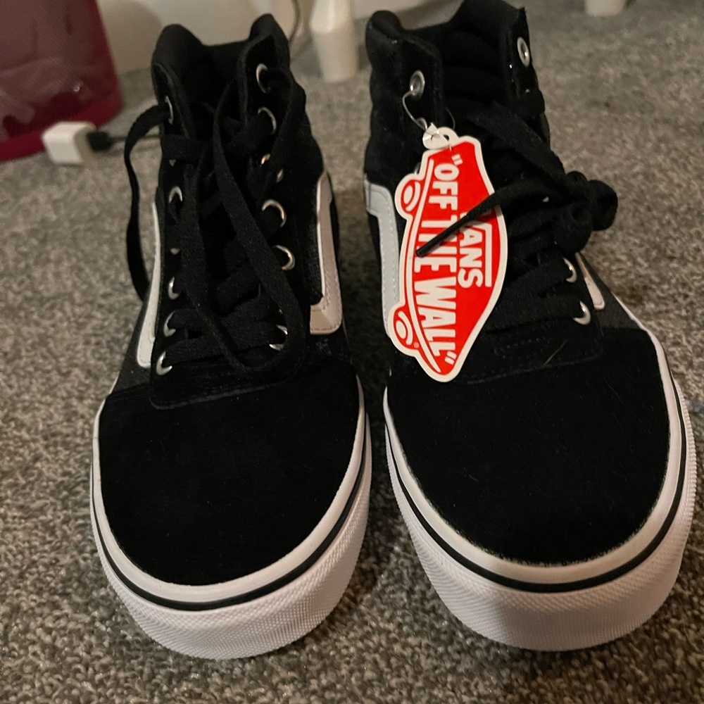 Vans high tops. never worn before. 7 1/2 to big for me.